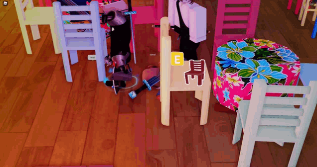 a wooden floor with chairs and a table with the letter e visible