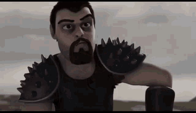 a cartoon character with a beard and spiked armor is looking at the camera .