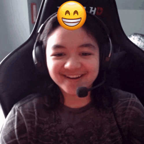 a girl wearing headphones has a smiley face on her face