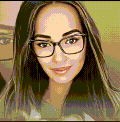 a woman wearing glasses and a blue shirt is looking at the camera .