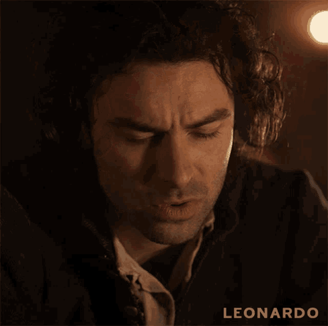 a close up of a man 's face with the word leonardo on the bottom right