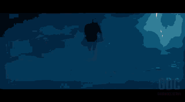 a person is holding a light saber in their hand in a dark room .