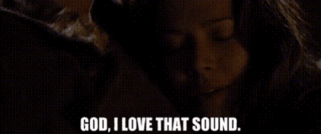 a close up of a woman 's face with the words `` god , i love that sound '' written on it .