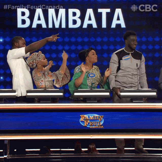 a group of people on a family feud show