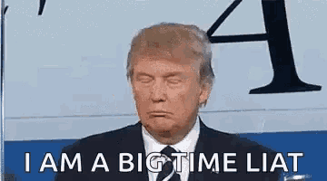 donald trump is wearing a suit and tie and making a funny face while standing in front of a clock .