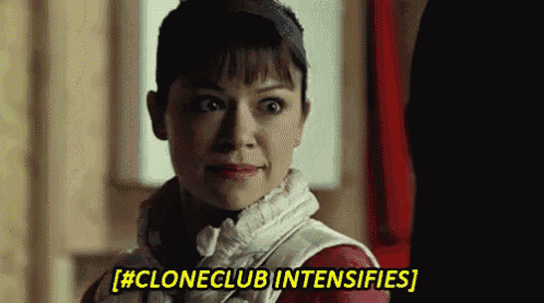 a close up of a woman 's face with the words cloneclub intensifies above her