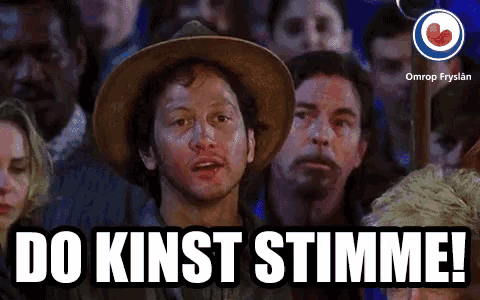 a man in a cowboy hat stands in front of a crowd and says do kunst stimme