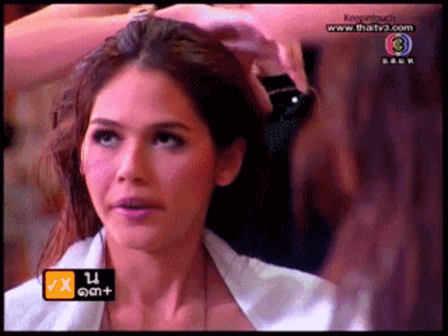 a close up of a woman 's face with the number 3 on the bottom right