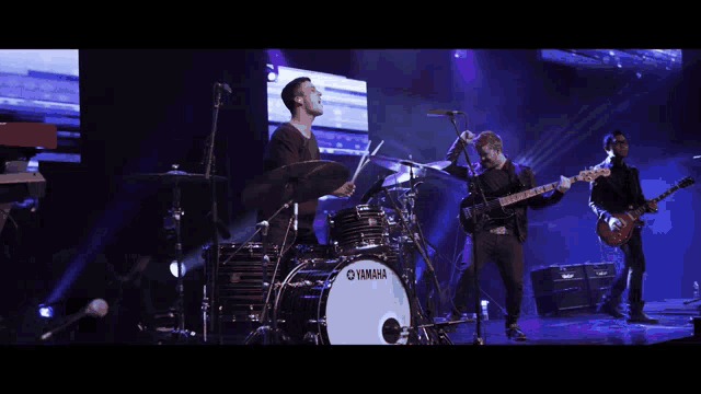 a yamaha drum set is being used by a band