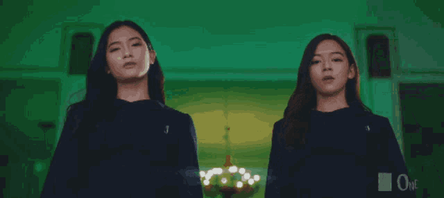 two girls standing next to each other with one wearing a shirt that says sb one