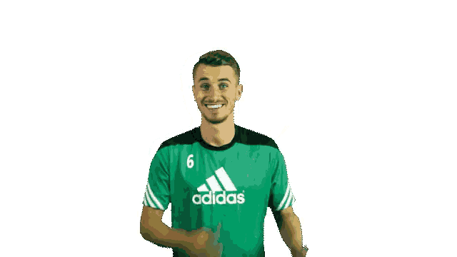 a man wearing a green adidas shirt with the number 6 on the front