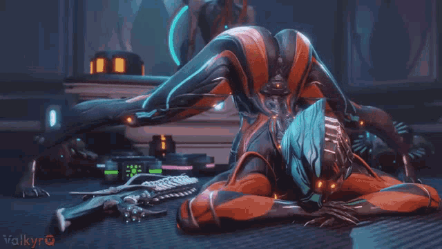 a woman in a futuristic suit is laying on the floor in a room .