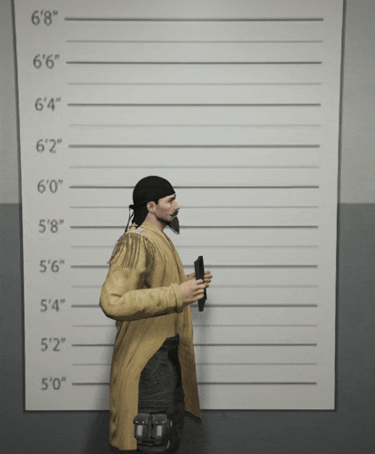 a man is standing in front of a wall with a height chart