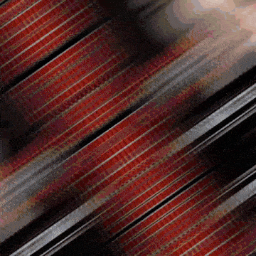a blurred image of a red and black striped fabric