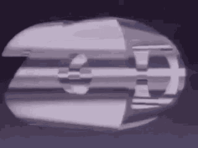 a purple and white object is floating in the air on a blue background .