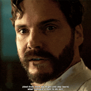 a man with a beard says " and from them we might one day learn what compelled a man to do evil "