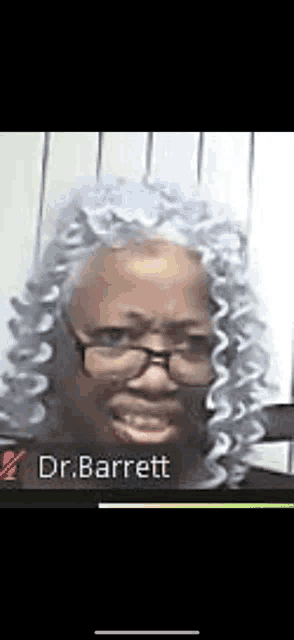 a woman with glasses and gray hair is talking on a video call with dr. barrett .