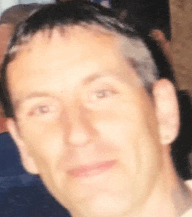 a close up of a man 's face with sunglasses on .