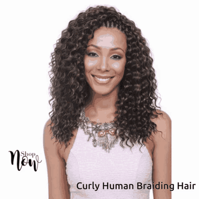 a woman with curly human braiding hair is smiling and wearing a white top