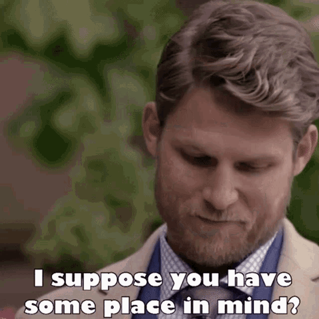 a man with a beard is wearing a suit and tie and says `` i suppose you have some place in mind '' .