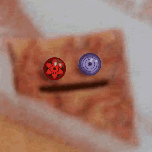 a drawing of a face with a red and purple ball on it