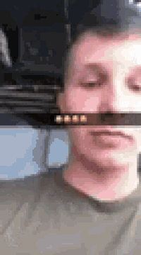 a close up of a man 's face with a snapchat filter on .