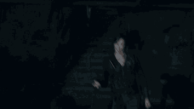 a man in a black shirt with the letter g on it is being punched