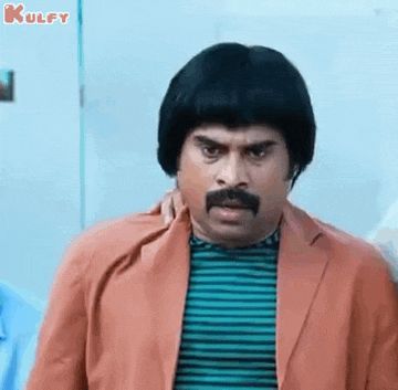 a man with a mustache and wig is wearing a striped shirt and a red jacket .
