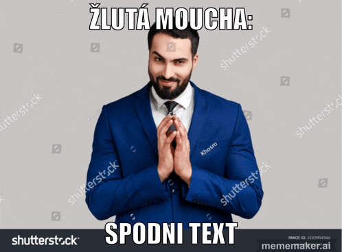 a man in a blue suit and tie is making a funny face