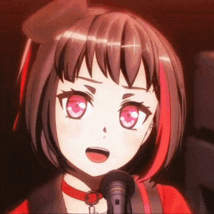 a close up of a girl singing into a microphone with red hair and pink eyes .