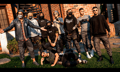 a group of young men posing for a picture with one wearing a shirt that says ' tokyo '