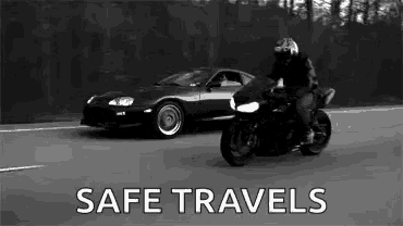 a man is riding a motorcycle next to a car with the words `` safe travels '' written on the bottom .