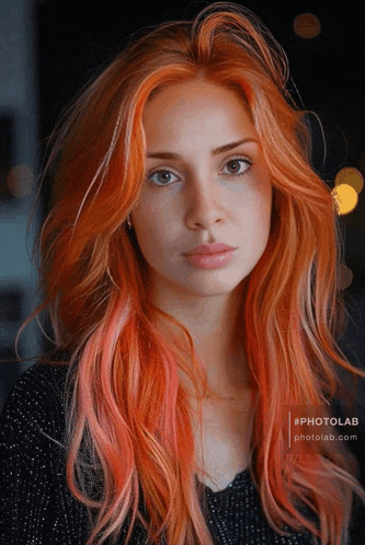 a woman with long red hair is wearing a black sweater with photolab written on the bottom