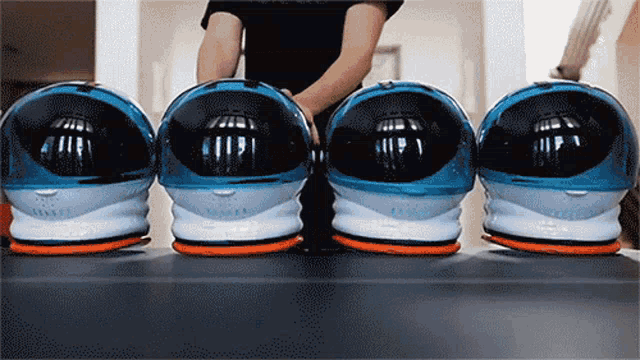a row of space helmets are lined up in a row