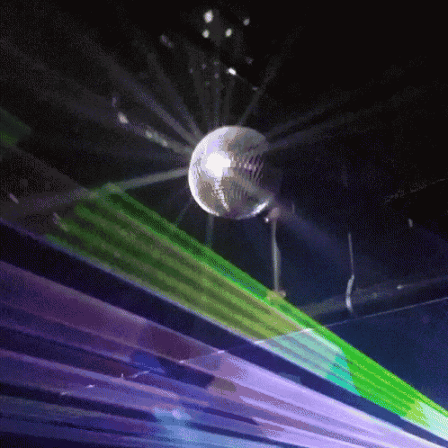 a disco ball is surrounded by a rainbow of lights