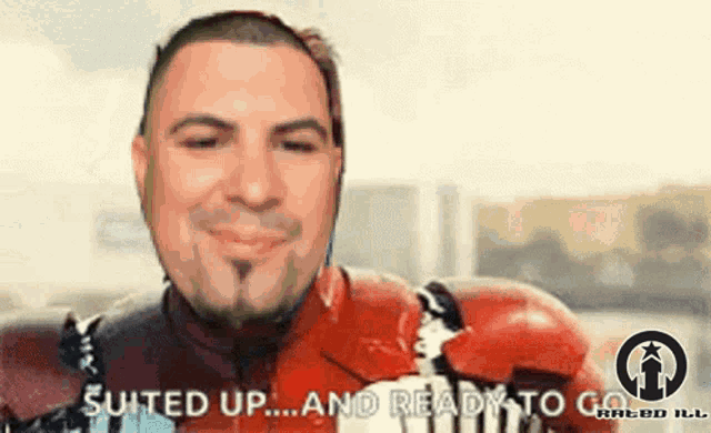 a man in a red suit is ready to go
