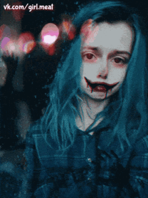 a picture of a girl with blue hair has the website vk.com/girl.meat written below it