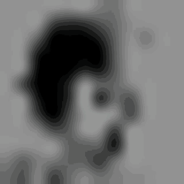 a blurry picture of a person 's face with glasses on .