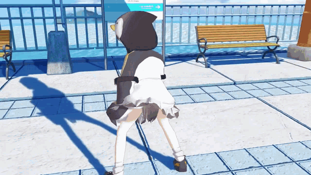 a girl in a penguin costume stands in front of a bench