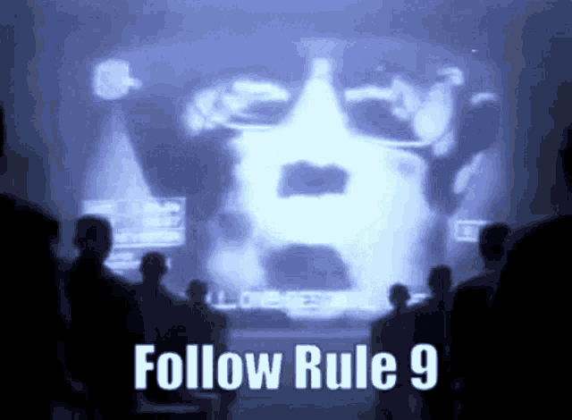 a group of people are looking at a screen that says " follow rule 9 "