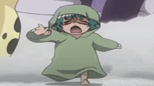 a little girl is wearing a green hoodie and walking .