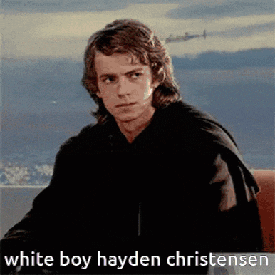 a man is sitting in front of a window with the words white boy hayden christensen below him