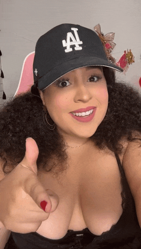 a woman wearing a hat with the letter a on it