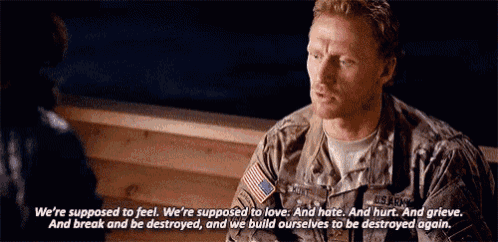a man in a u.s. army uniform is talking to another man .