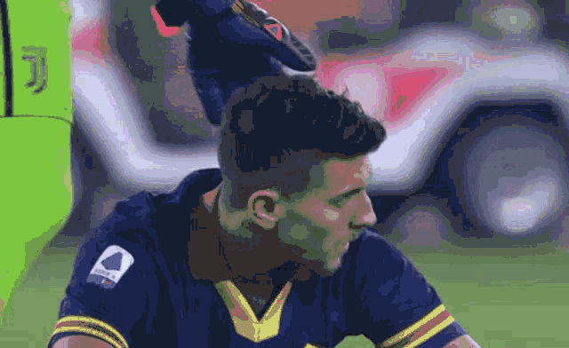 a soccer player with the letter j on his shirt