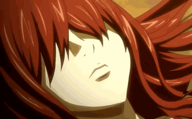 a close up of a red haired anime character 's face