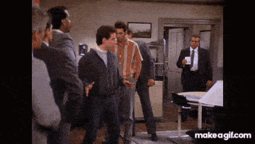 a group of men are standing in a room with the words make a gif.com on the bottom right