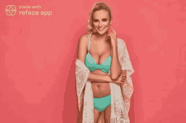 a woman in a bikini and a white robe is standing on a pink background and smiling .