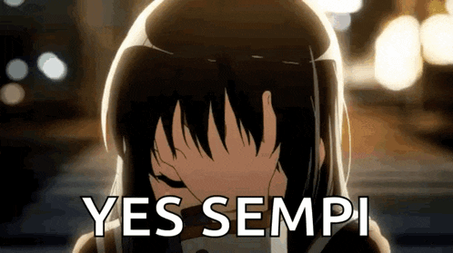 a girl is covering her face with her hand and the words `` yes sempi '' are written on the bottom .