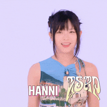 a girl with the name hanni written on her shirt